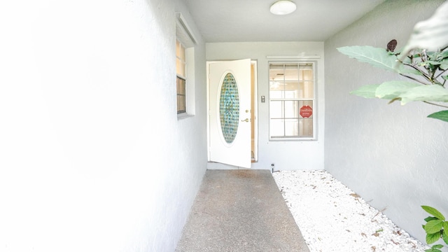 doorway to property with stucco siding