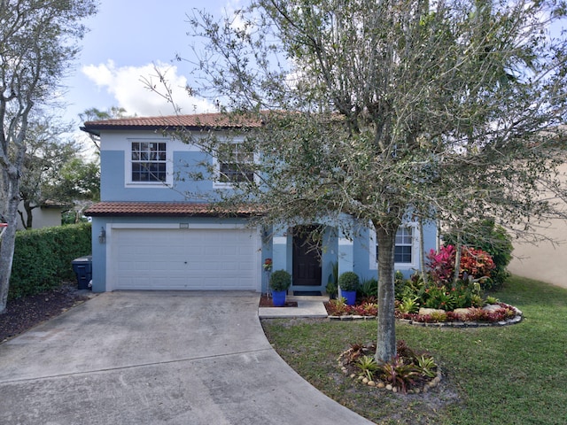 view of front of house featuring an attached garage, a tiled roof, concrete driveway, stucco siding, and a front yard