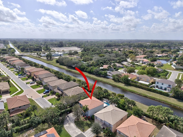 bird's eye view featuring a residential view and a water view