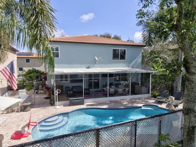 view of swimming pool with a fenced in pool, a patio area, fence, and outdoor lounge area