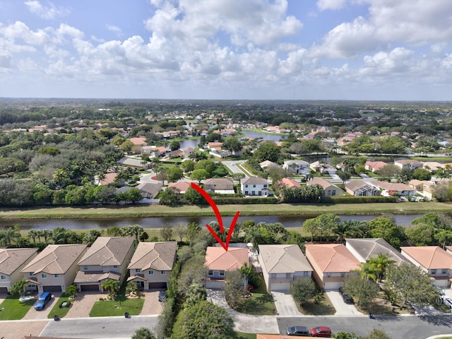 aerial view featuring a water view and a residential view