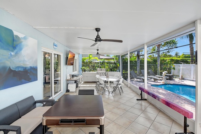 sunroom / solarium with ceiling fan