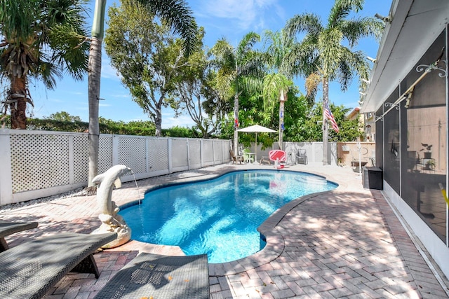 view of swimming pool with a patio, a fenced backyard, and a fenced in pool