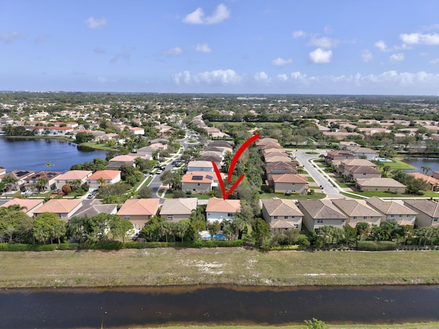 aerial view with a residential view and a water view