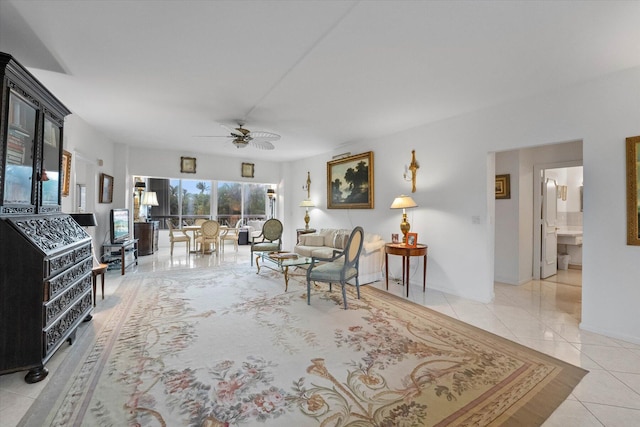 tiled living room with ceiling fan