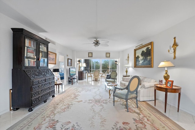 tiled living room featuring ceiling fan