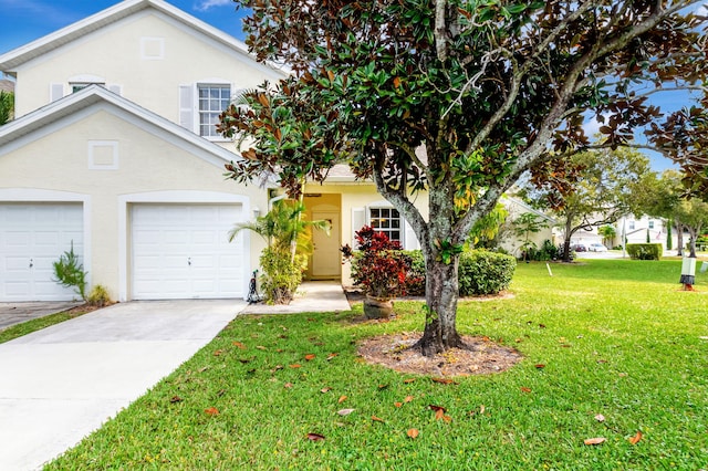 view of front facade featuring a front yard and a garage