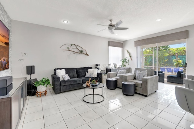 9602 Fox Trot Ln, Boca Raton, FL 33496 - living room featuring a textured ceiling, ceiling fan, and light tile patterned floors