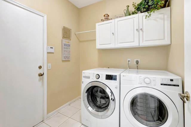 9602 Fox Trot Ln, Boca Raton, FL 33496 - laundry area with cabinets, washer and dryer, and light tile patterned floors