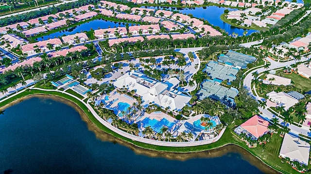 bird's eye view featuring a water view and a residential view