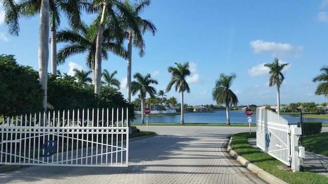 9765 Bowline Dr Unit 201, West Palm Beach, FL 33411 - view of gate with a water view and fence