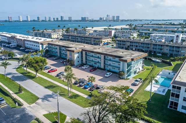 drone / aerial view with a view of city and a water view