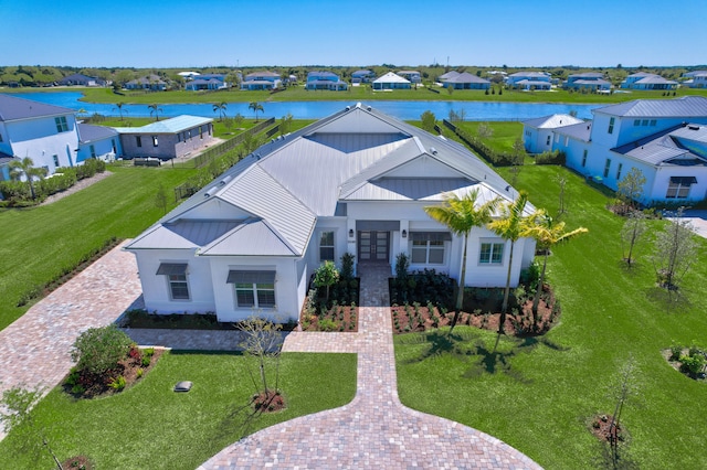 aerial view featuring a residential view and a water view