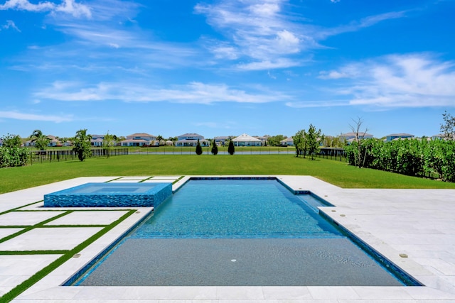 outdoor pool with a patio area, a lawn, an in ground hot tub, and fence