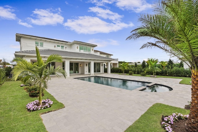 view of pool with a yard and a patio area