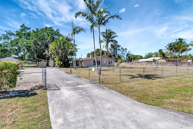 view of road with a gated entry, driveway, and a gate