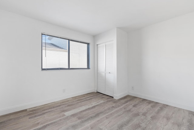 unfurnished room with light hardwood / wood-style floors