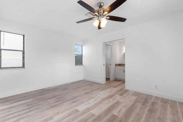 spare room with ceiling fan and light hardwood / wood-style flooring