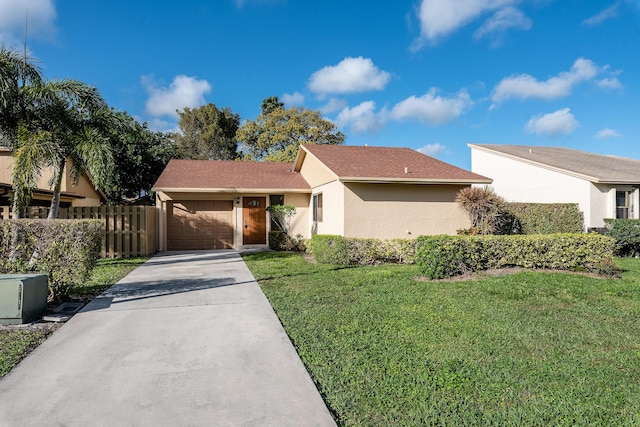 single story home with a garage and a front yard