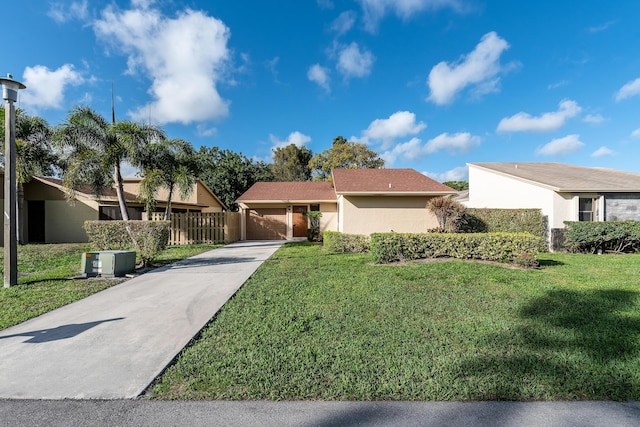 single story home featuring a front lawn