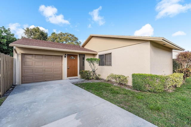 view of front facade featuring a front lawn and a garage