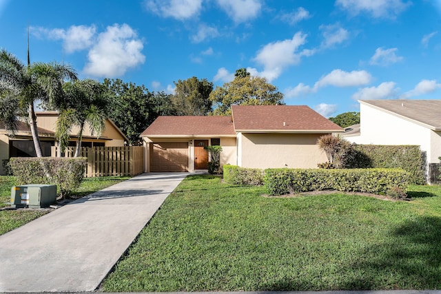 single story home with a front lawn and a garage