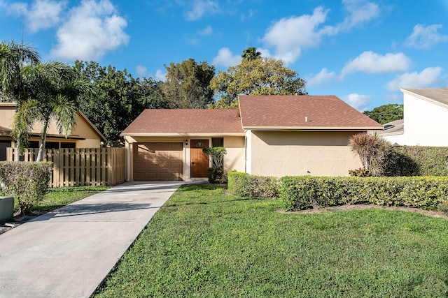 single story home with a front lawn and a garage