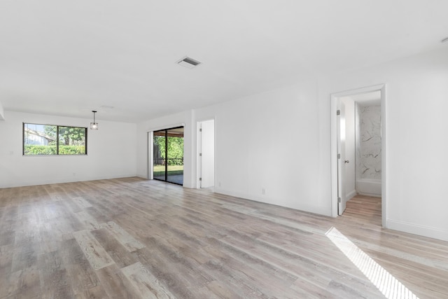 spare room featuring light hardwood / wood-style floors