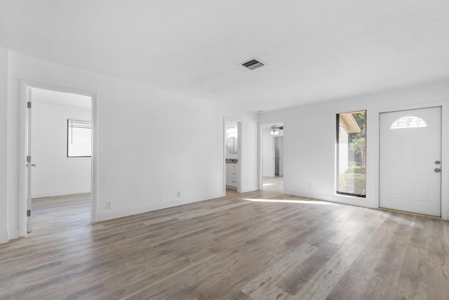 unfurnished living room with light wood-type flooring