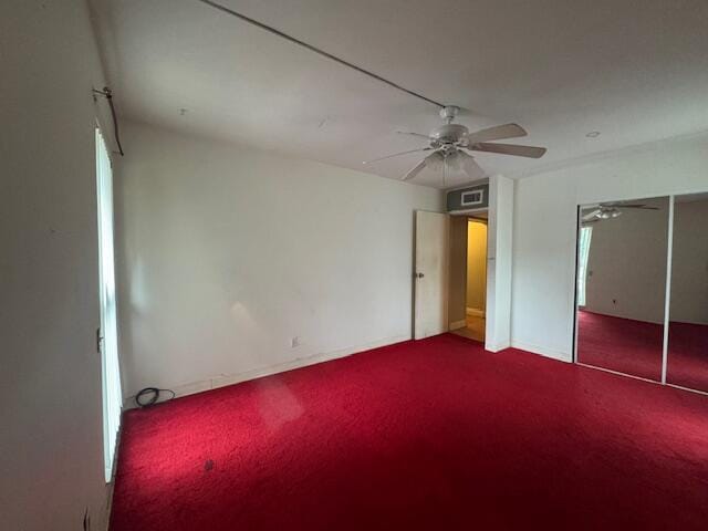 unfurnished bedroom with a closet, carpet flooring, and ceiling fan