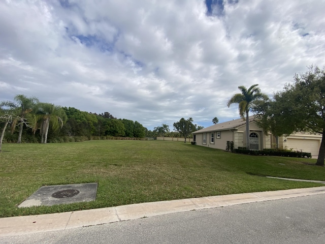 view of yard featuring a garage