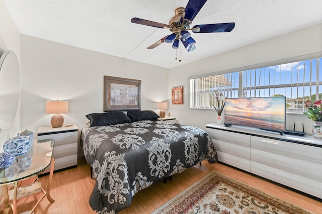 bedroom featuring wood finished floors and a ceiling fan