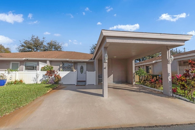 ranch-style home with fence and stucco siding