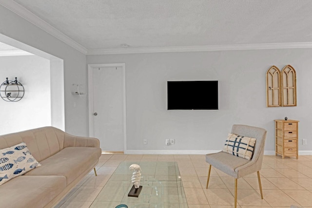 living area with crown molding, a textured ceiling, baseboards, and tile patterned floors