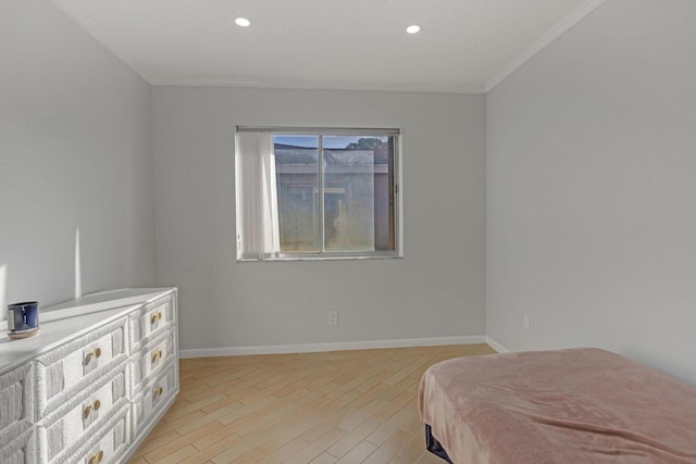 bedroom featuring light wood finished floors, baseboards, ornamental molding, and recessed lighting