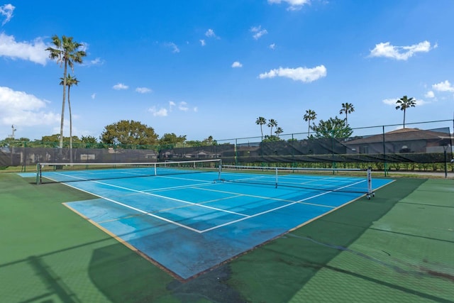 view of sport court with fence