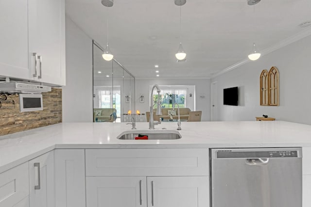 kitchen with ornamental molding, white cabinetry, a sink, dishwasher, and a peninsula