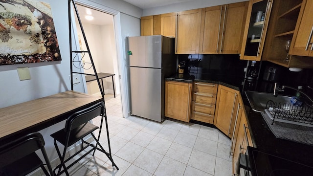 3100 N Palm Aire Dr Unit 604, Pompano Beach, FL 33069 - kitchen with stainless steel refrigerator, light tile patterned floors, and sink