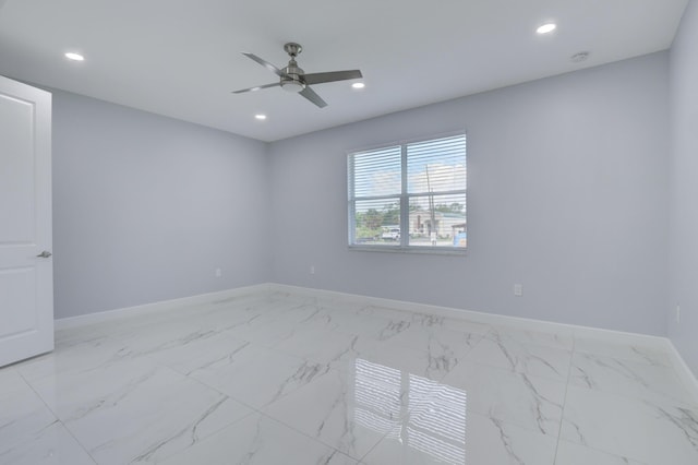 unfurnished room featuring marble finish floor, ceiling fan, baseboards, and recessed lighting