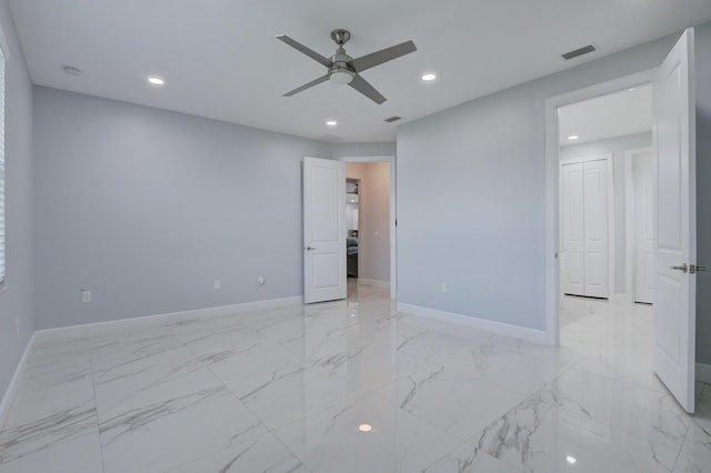 unfurnished bedroom with recessed lighting, marble finish floor, visible vents, and baseboards