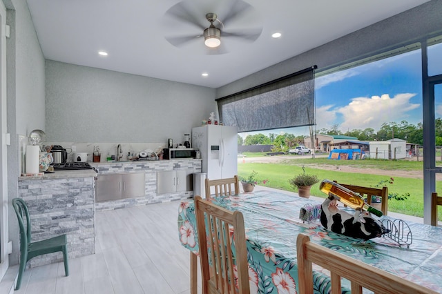 dining area featuring ceiling fan and recessed lighting