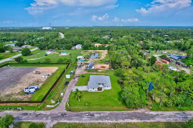 drone / aerial view with a view of trees