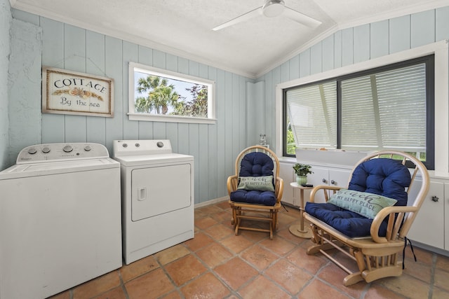 306 Fernandina St, Fort Pierce, FL 34949 - laundry room featuring washer and clothes dryer, ceiling fan, ornamental molding, wood walls, and a textured ceiling