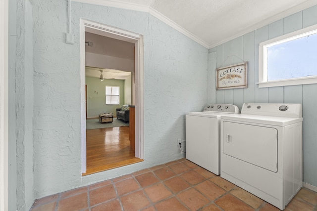 306 Fernandina St, Fort Pierce, FL 34949 - washroom featuring crown molding, washer and clothes dryer, and a textured wall