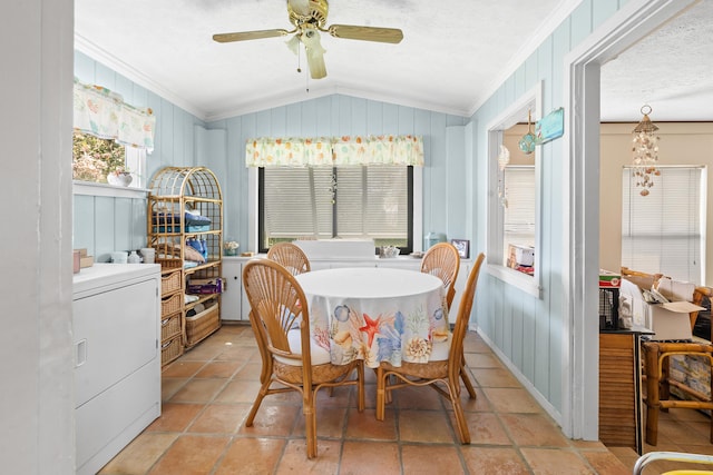 dining space featuring ornamental molding, lofted ceiling, washer / clothes dryer, and a textured ceiling