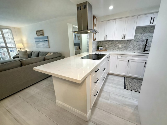 kitchen featuring black electric stovetop, white cabinetry, island exhaust hood, and kitchen peninsula