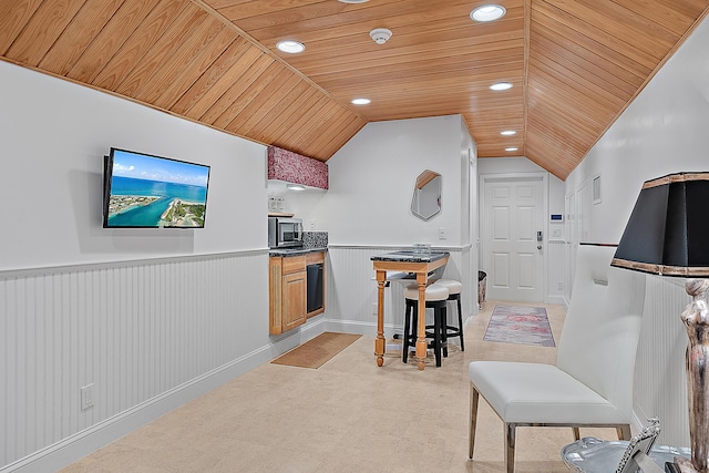 kitchen with stainless steel microwave, a wainscoted wall, wood ceiling, lofted ceiling, and recessed lighting