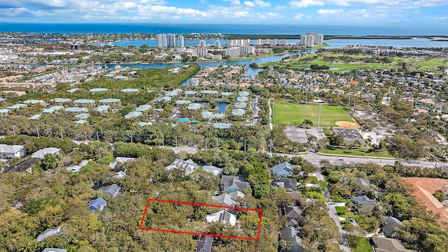 birds eye view of property with a water view