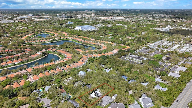 drone / aerial view featuring a water view and a residential view