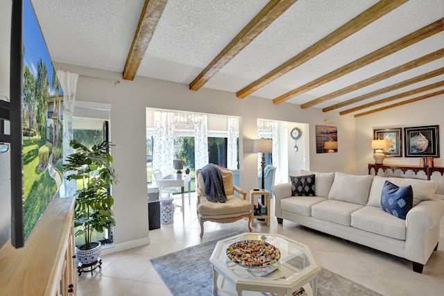 living area with vaulted ceiling with beams, light tile patterned floors, baseboards, and a textured ceiling